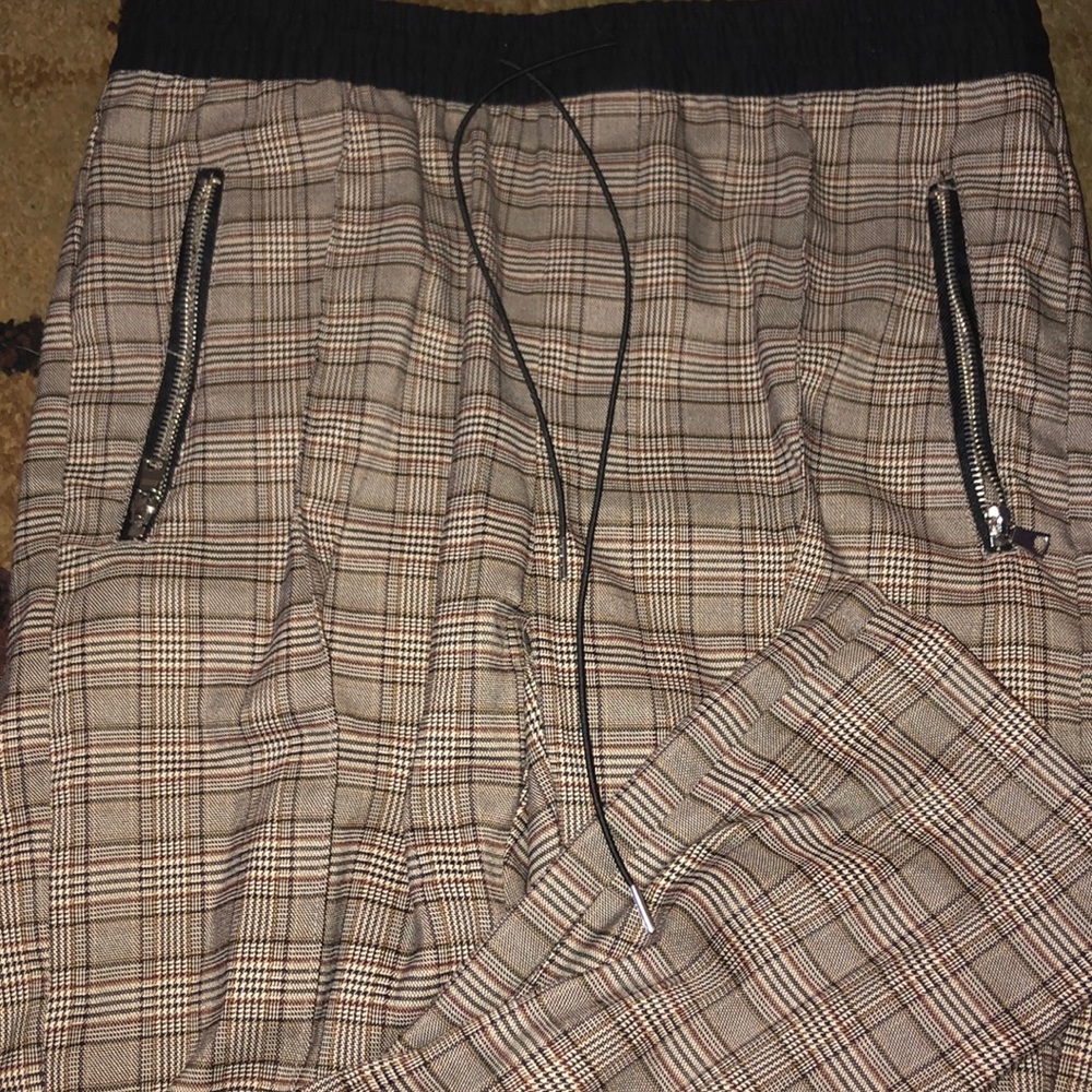Plaid pants. Tan. Zipper pockets.